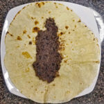 Lägg på refried beans eller valfria bönor